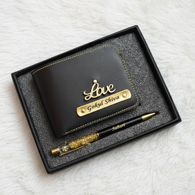 Black wallet and pen set with 'Love' engraving in a box on a white textured background